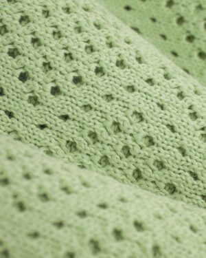 A close up of the Dandy Del Mar Antibes Crochet Shirt - Pistachio.