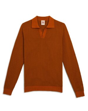 The Sebastian Long Sleeve Polo in Burnt Sienna by Dandy Del Mar, a rust-colored 100% cotton knit sweater with a wide collar and V-neck, is elegantly displayed flat on a white background.